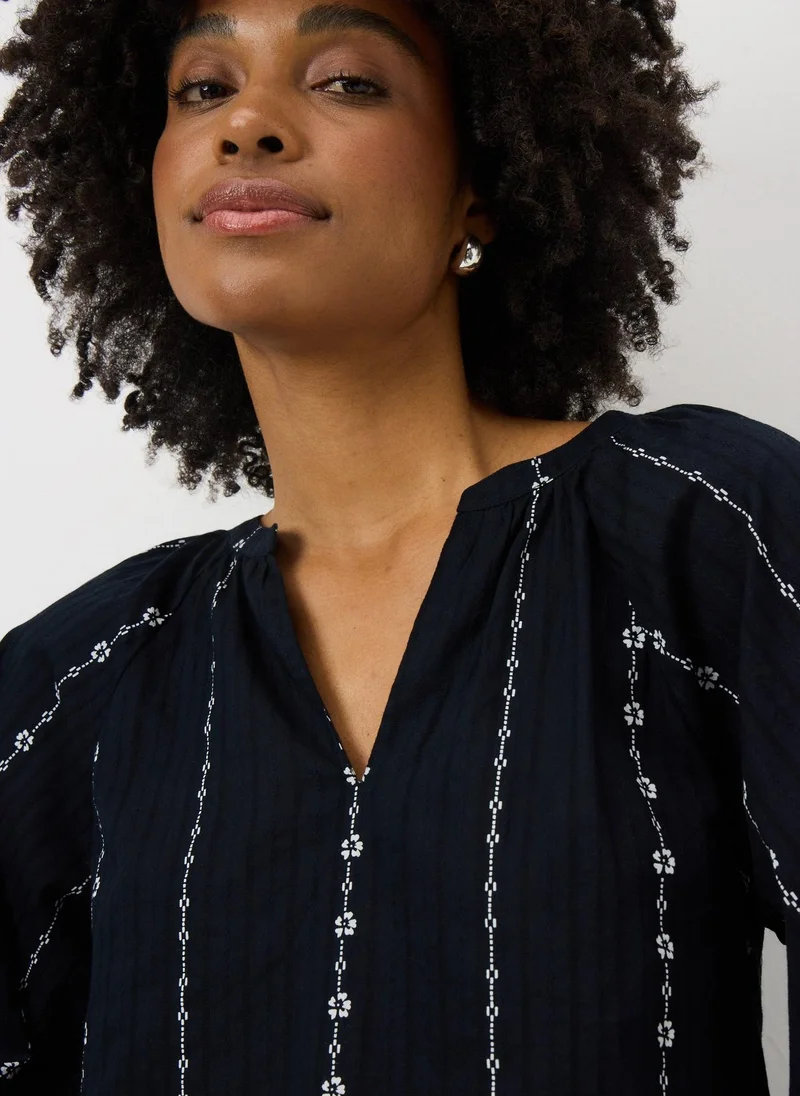 ماتلان بلوزة سوداء بنقش دوامة