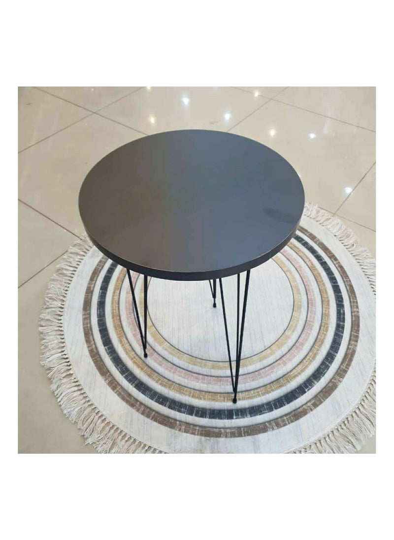 Single coffee table with wood top and iron legs in a modern design