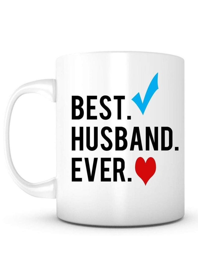 حكاية شمعة مج من السيراميك بطبعة تصميم "Best Husband Ever " بلون أبيض - Image 1