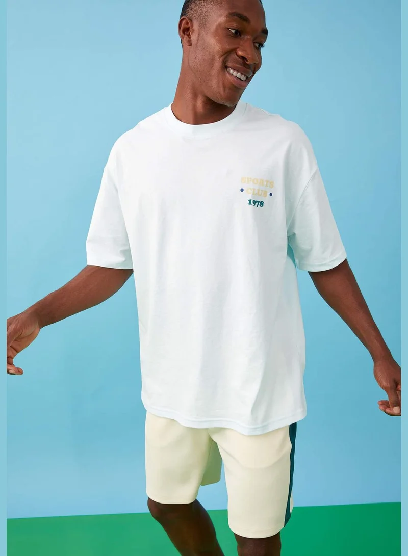 ديفاكتو Oversize Fit Short Sleeve Back Printed Boat Neck T Shirt