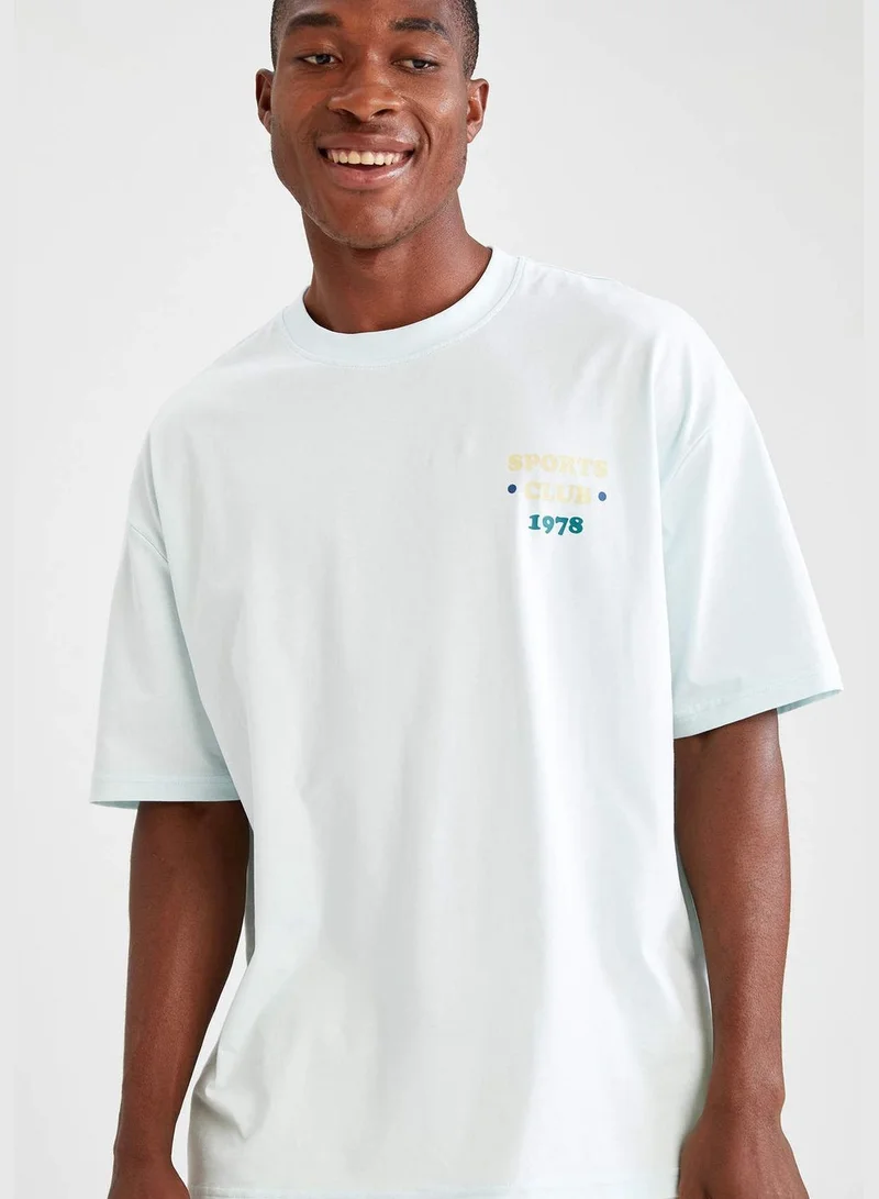 ديفاكتو Oversize Fit Short Sleeve Back Printed Boat Neck T Shirt