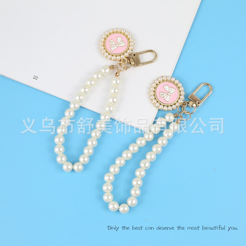 New Pearl Car Keychain Pendant Creative Bow Pearl Round Brand Accessories سماعة أذن مجموعة ديكور حقيبة النساء - Image 4