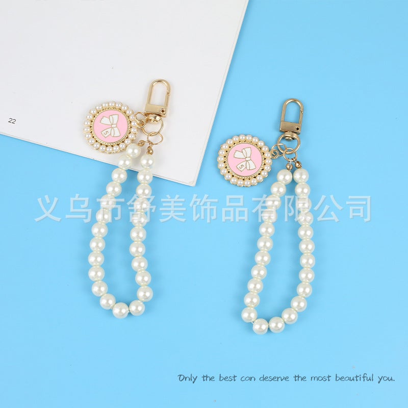 New Pearl Car Keychain Pendant Creative Bow Pearl Round Brand Accessories سماعة أذن مجموعة ديكور حقيبة النساء - Image 3