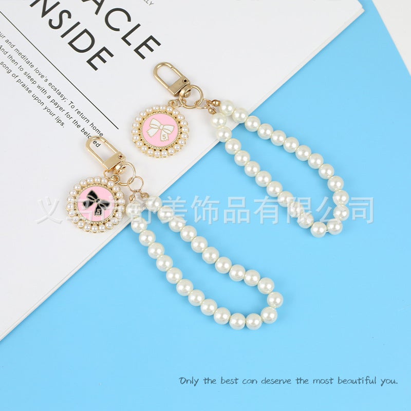 New Pearl Car Keychain Pendant Creative Bow Pearl Round Brand Accessories سماعة أذن مجموعة ديكور حقيبة النساء - Image 2