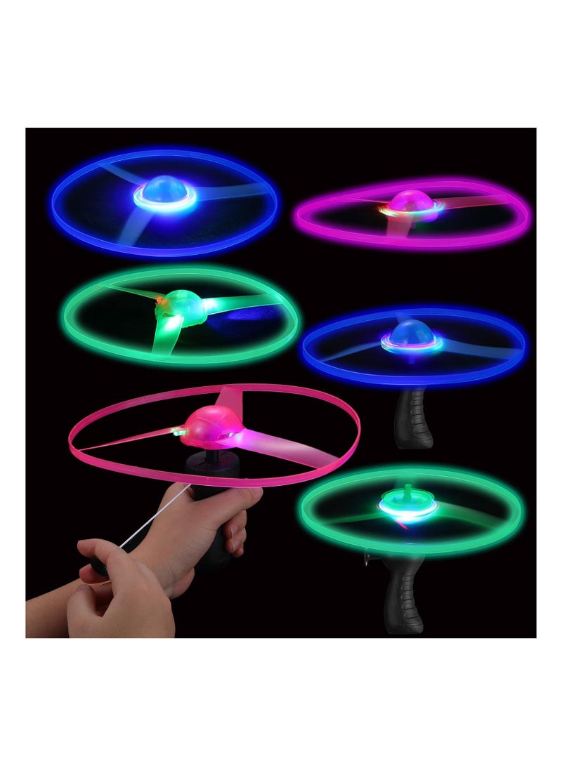 SYOSI 6 Pieces Flying Sets Light Up Disco Flyers Flying Spinner with Launchers and Lights Colorful Flying Disc LED Pull String for Indoor Outdoor Games Multicolor - Image 1