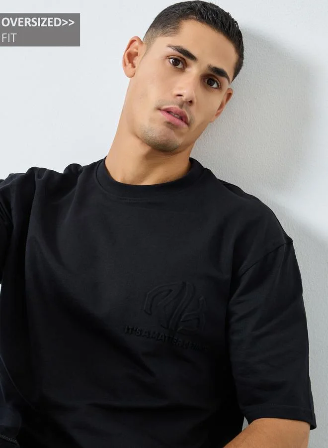 Styli Styli Men Black Oversized Embossed Print T-Shirt
