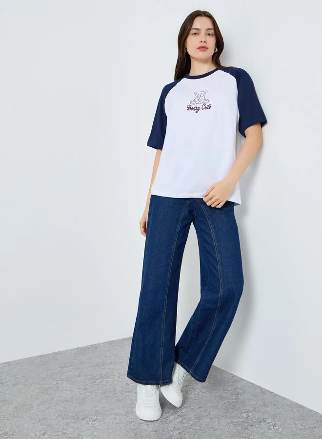 Styli Women Graphic Raglan Sleeve Oversized T-Shirt