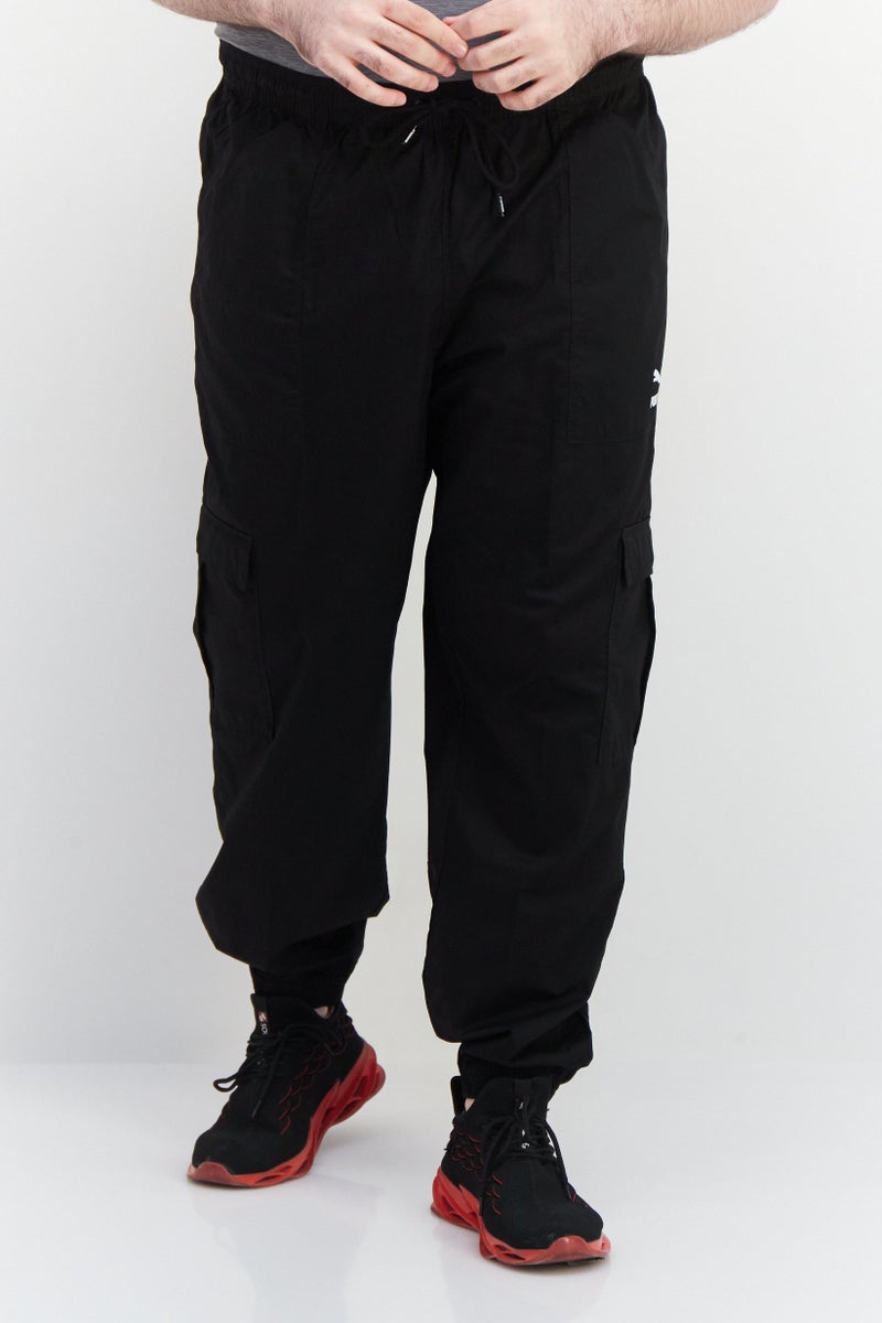 PUMA Men Sportswear Fit Brand Logo Track Pants, Black - Image 1