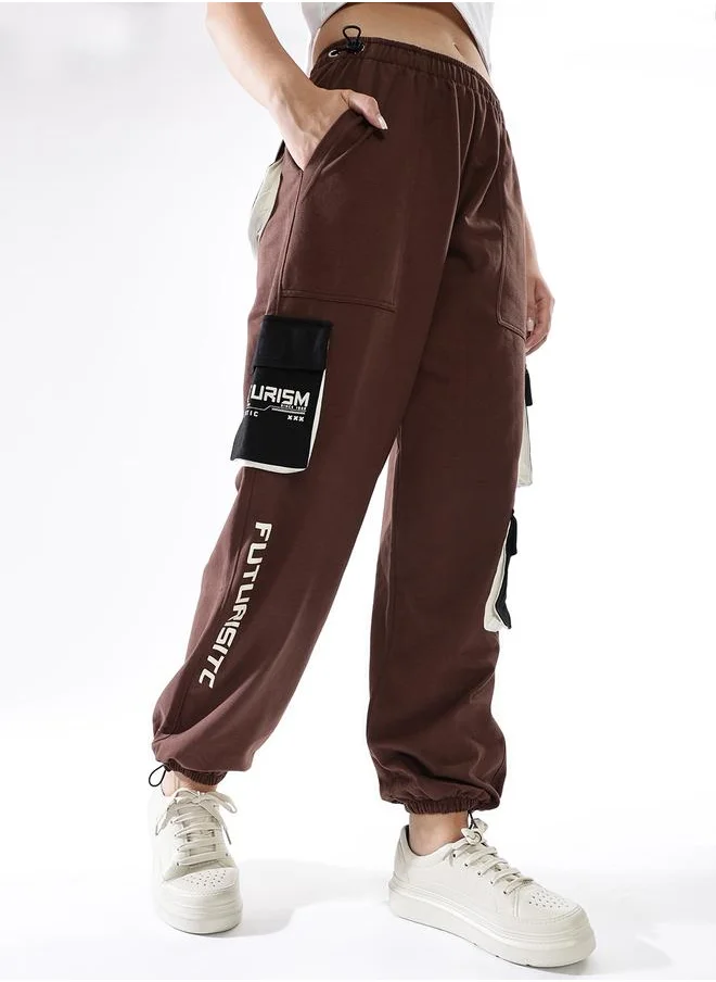 هوبرهولمي Women Track Pants in Multicolor featuring Jogger fit with a printed pattern, no sleeves, regular length, secured with elasicated + drawstring closure, crafted from terry – a must-have for those who love trendy fashion.