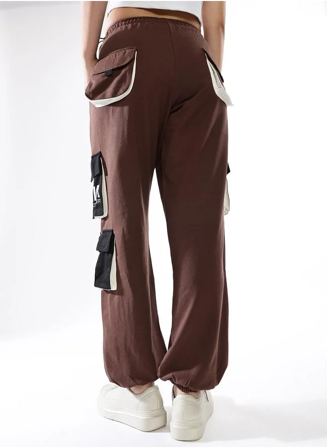 هوبرهولمي Women Track Pants in Multicolor featuring Jogger fit with a printed pattern, no sleeves, regular length, secured with elasicated + drawstring closure, crafted from terry – a must-have for those who love trendy fashion.