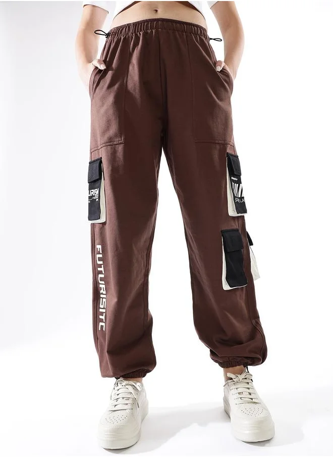 هوبرهولمي Women Track Pants in Multicolor featuring Jogger fit with a printed pattern, no sleeves, regular length, secured with elasicated + drawstring closure, crafted from terry – a must-have for those who love trendy fashion.