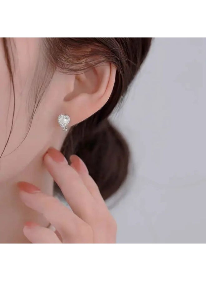 Luxuria Small heart-shaped hoop earrings adorned with a central stone surrounded by a halo of small stones, "Hage Halo Earrings". - Image 3