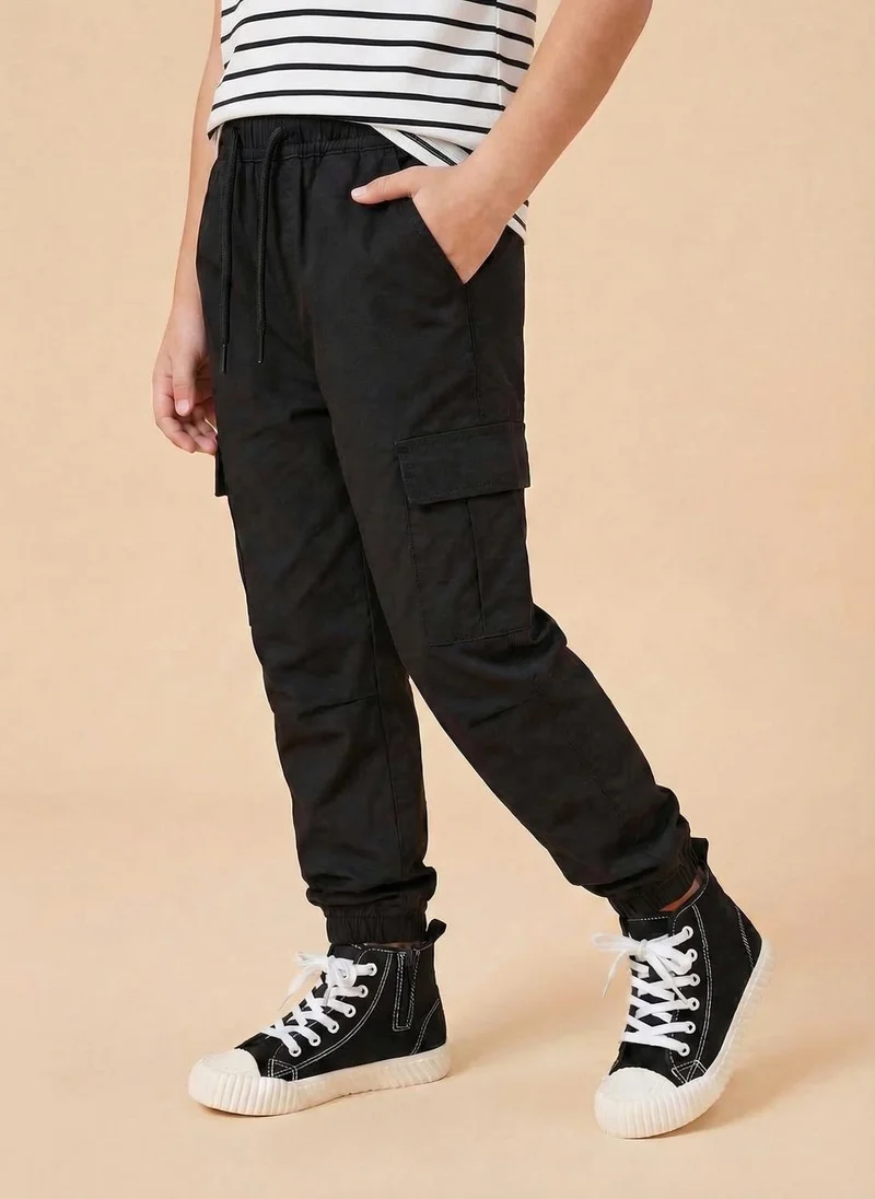 نوتيناتي Nautinati Boys’ Solid Relaxed Fit Woven Parachute Pants with Utility Pockets