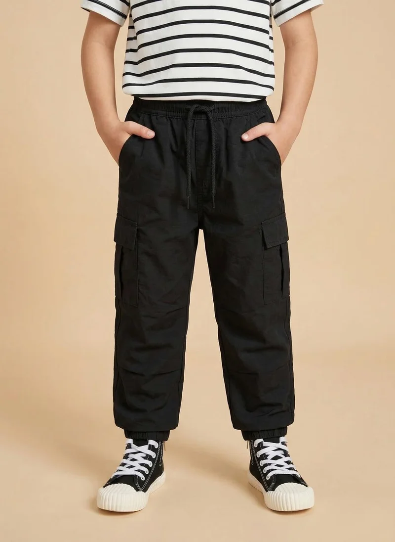 نوتيناتي Nautinati Boys’ Solid Relaxed Fit Woven Parachute Pants with Utility Pockets