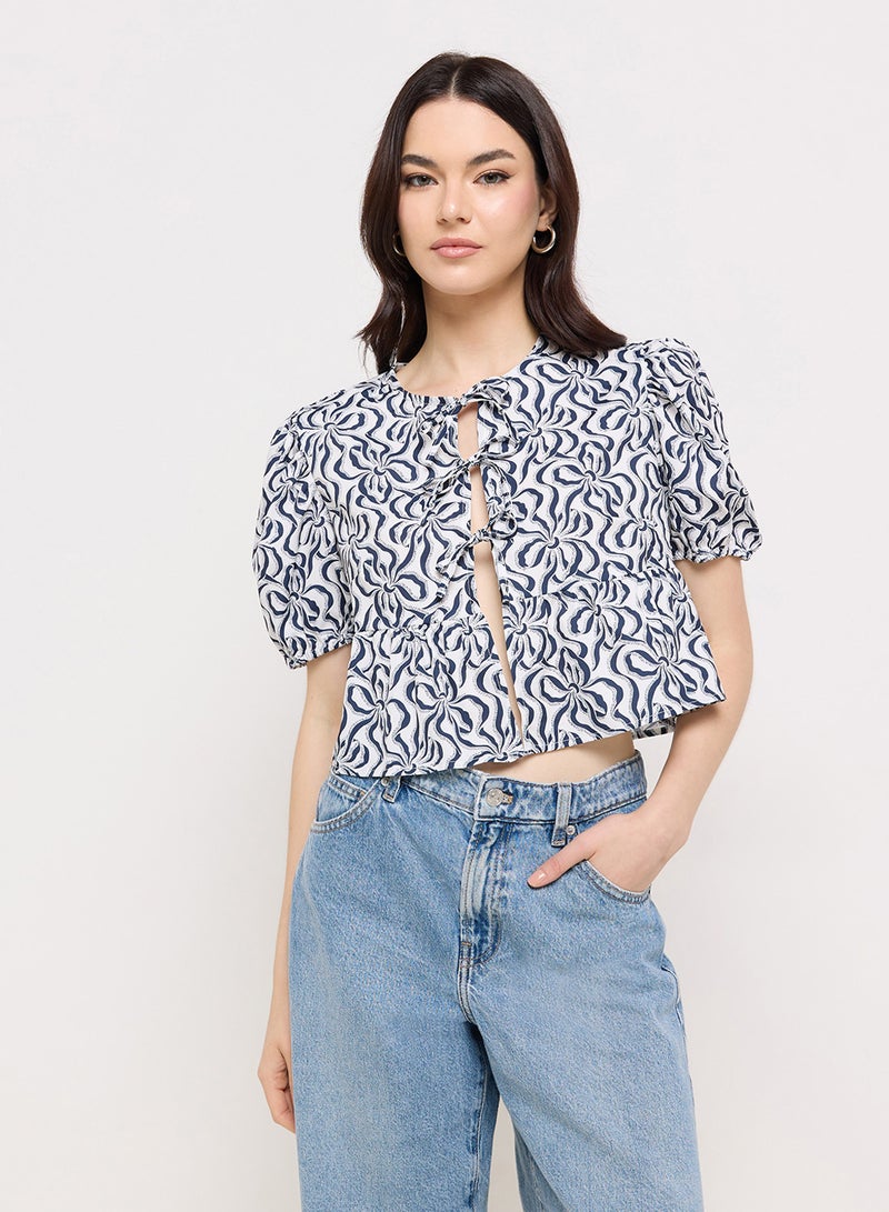 Ginger Puff Sleeve Printed Tie Up Peplum Blouse - Image 1