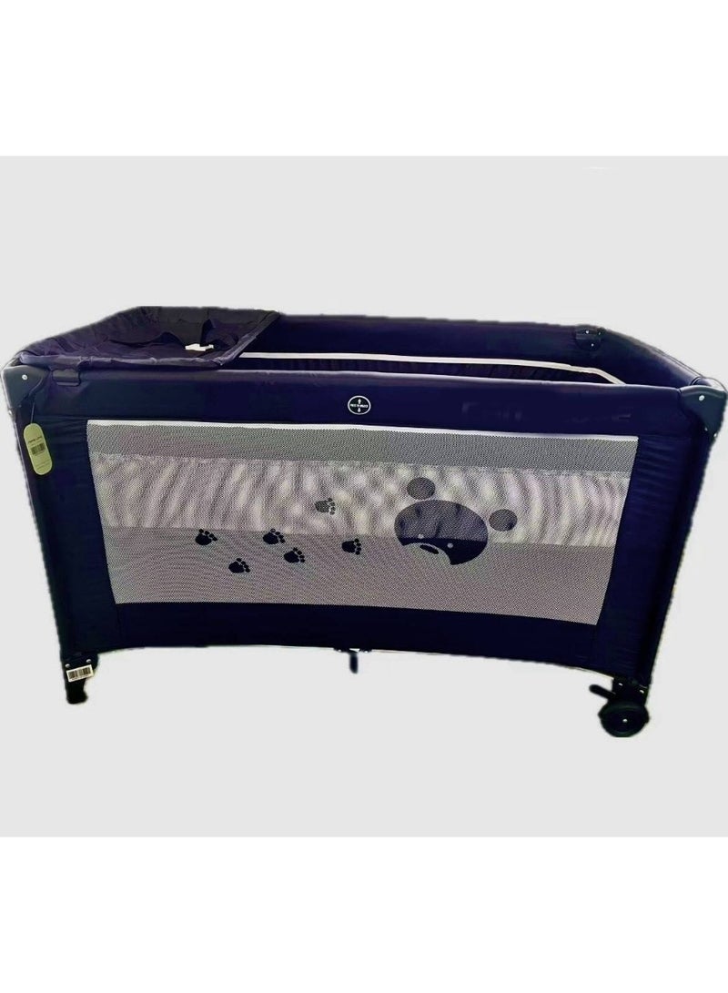 A baby bed a double playpen and a diaper changing table