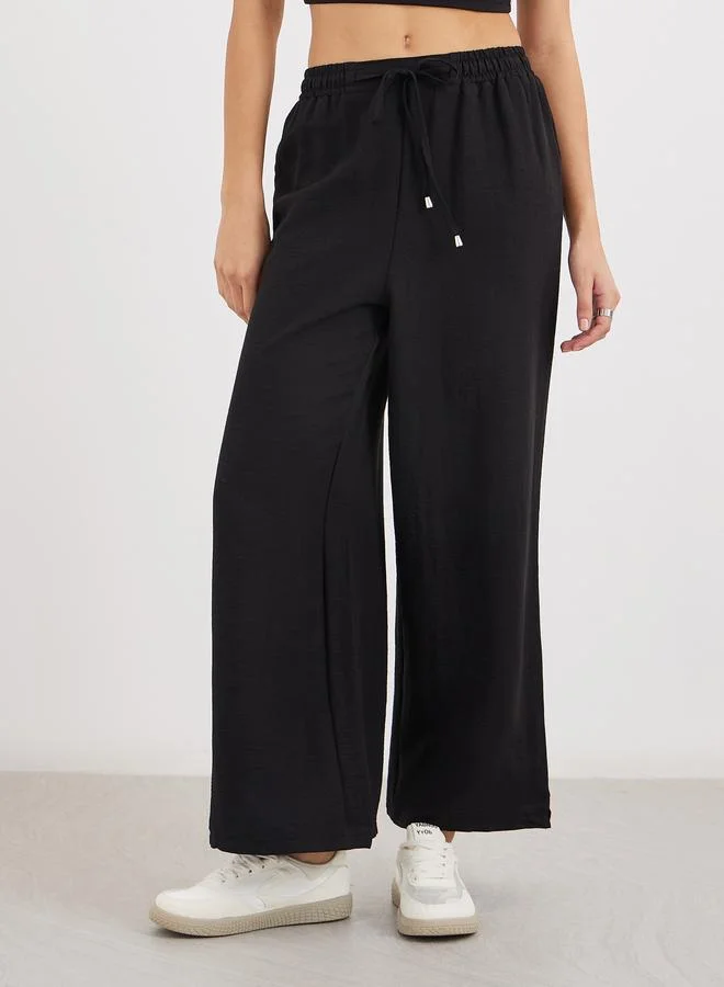 ستايلي Styli Solid Drawstring Waist Wide Leg Pants