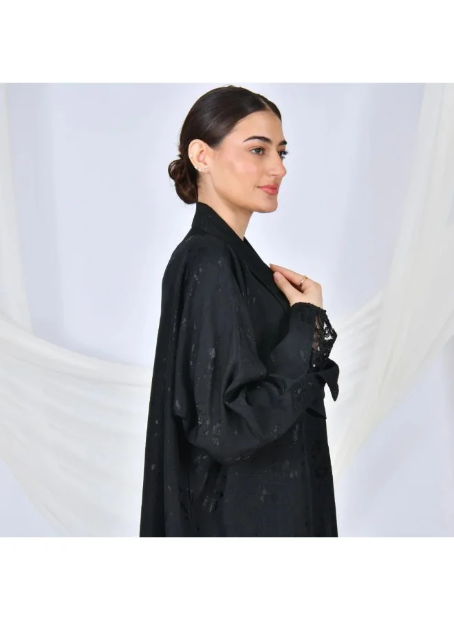 lamha abaya Black abaya wrapped in summer jacquard fabric with elegant ribbon overlap on the sleeves