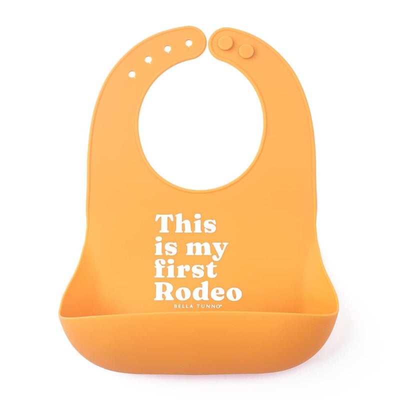 Bella Tunno Baby Bib for Eating, Waterproof Silicone Bib with Large Food Catcher, Adjustable Fit for Babies 4-12 months & Toddlers 1-3 Years, Boys & Girls, This Is My First Rodeo - Image 1