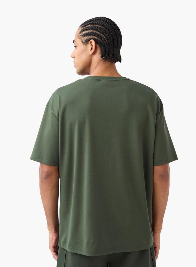 كابا تيشيرت بياقة ضيّقة وأكمام قصيرة وشعار من كابا - Image 3