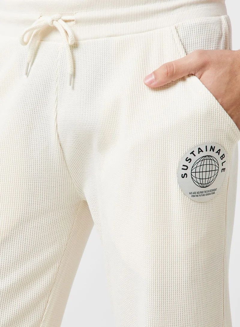 نمشي x بنطال رياضي منسوج بنمط وافل مستدام
