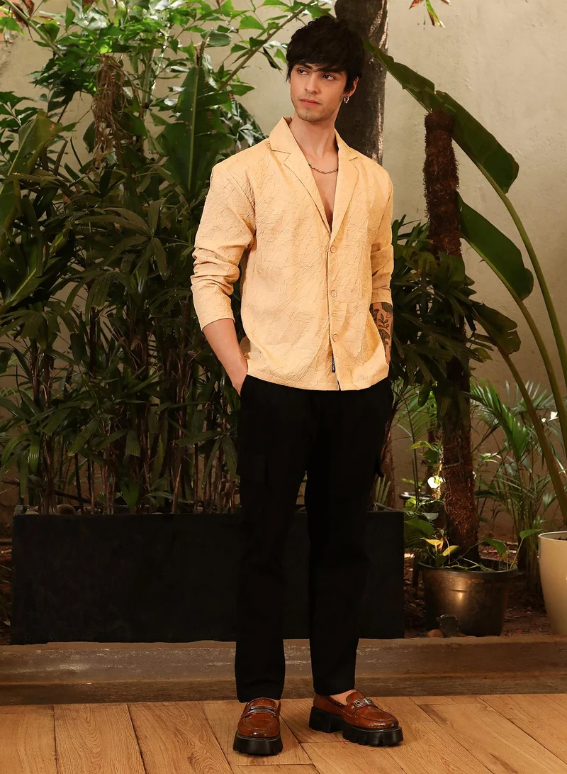 Campus Sutra Campus Sutra Men's Buff Beige Wrinked Korean Oversized Shirt For Casual Wear | Lapel Collar | Long Sleeve | Button Closure | Oversized Shirt Crafted With Comfort Fit For Everyday Wear