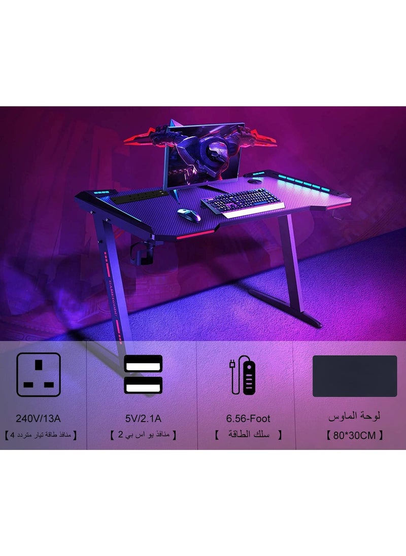 NOAEOU - 140cm×60cm Z-Shaped Gaming Desk with 4 AC Outlets and RGB Lighting, Large PC Table Includes Big Mouse Pad, Cup Holder and Headset Hook - Image 1