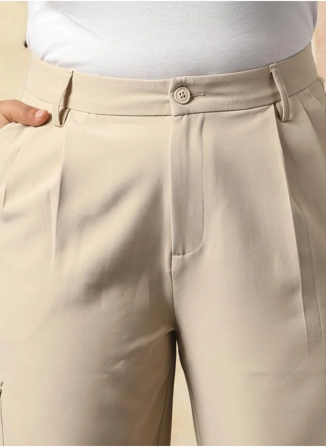 هاي ستار Women Trousers in Beige featuring Wide Leg fit with a solid pattern, regular length, secured with button closure, crafted from 95% polyester 5% spandex – crafted for those who appreciate style and comfort.