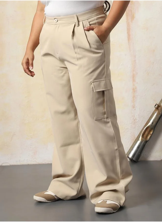 هاي ستار Women Trousers in Beige featuring Wide Leg fit with a solid pattern, regular length, secured with button closure, crafted from 95% polyester 5% spandex – crafted for those who appreciate style and comfort.