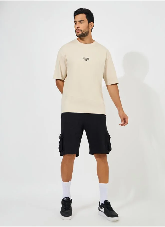 ستايلي Cut & Sew Oversized T-Shirt with Contrast Embroidery