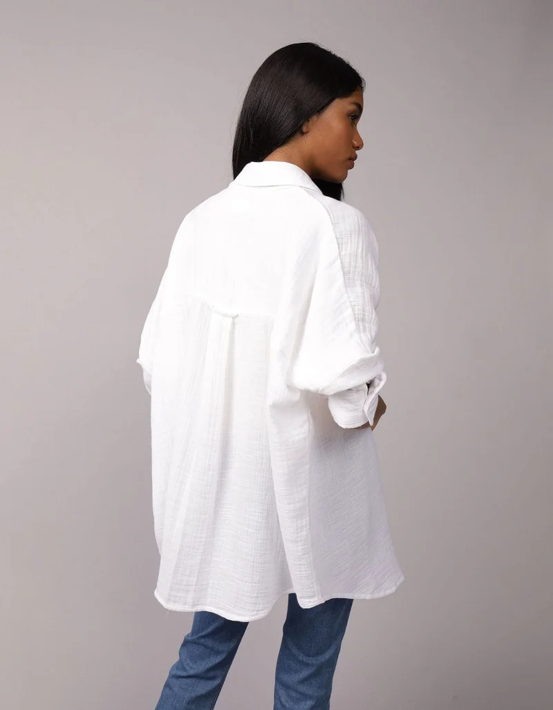 امريكان ايجل قميص فضفاض مزيّن بعبارة