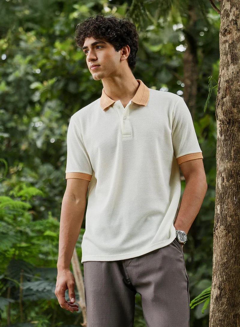 Campus Sutra Campus Sutra Men Block-Textured Knit Polo T-Shirt | Jacquard Polo Neck Short Cuffed Sleeves | Half-Button Closure | Colourblock Jacquard | Knitted Fabric For Casual & Daily Wear | Orange & White