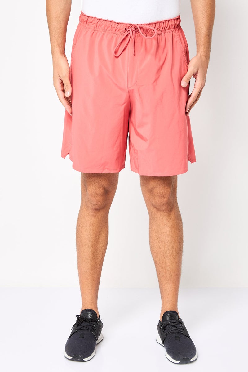 Nike شورت تدريب للرجال بقصة قياسية بطول 9 إنش، وردي قديم - Image 1