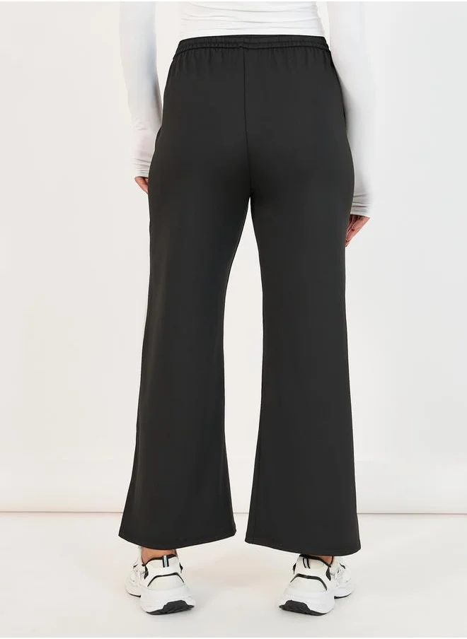 Styli Elastic Waist Slit Pocket Detail Straight Pant with Drawstring Closure
