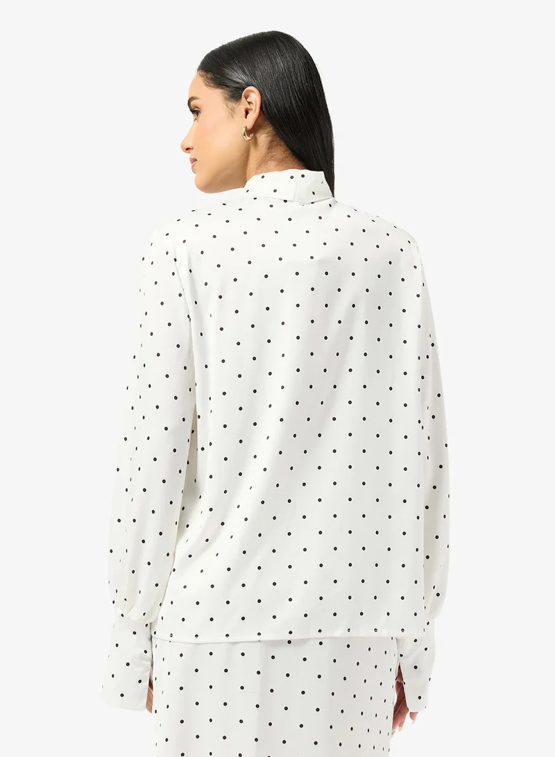 جينجر بلوزة بنقاط بولكا مع تفاصيل فيونكة