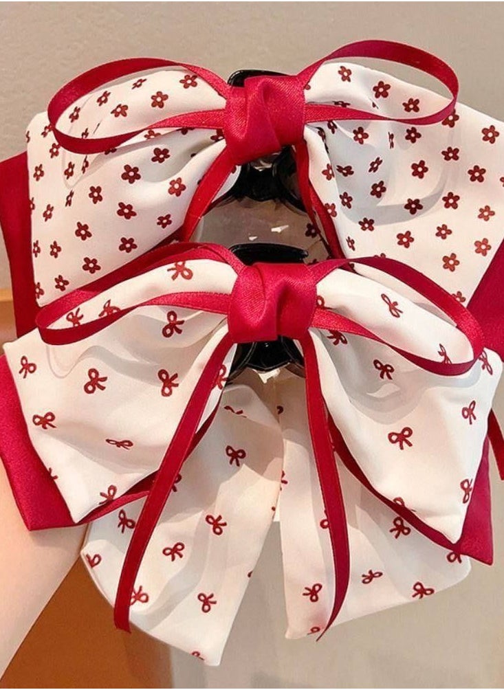 Generic - Add a touch of femininity and sophistication to your look with this hair bow. Designed with a double bow, this combination of white fabric is embellished with a heart and red dot pattern, finished with red satin trim for a stunning finish. The bow comes with a sturdy clip that secures the hair in place, perfect for anniversaries or special occasions. - Image 1