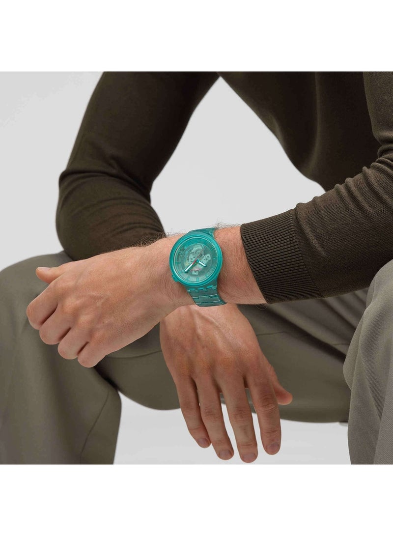 Swatch ساعة كوارتز تناظرية للجنسين باللون التركوازي JOY - Image 4