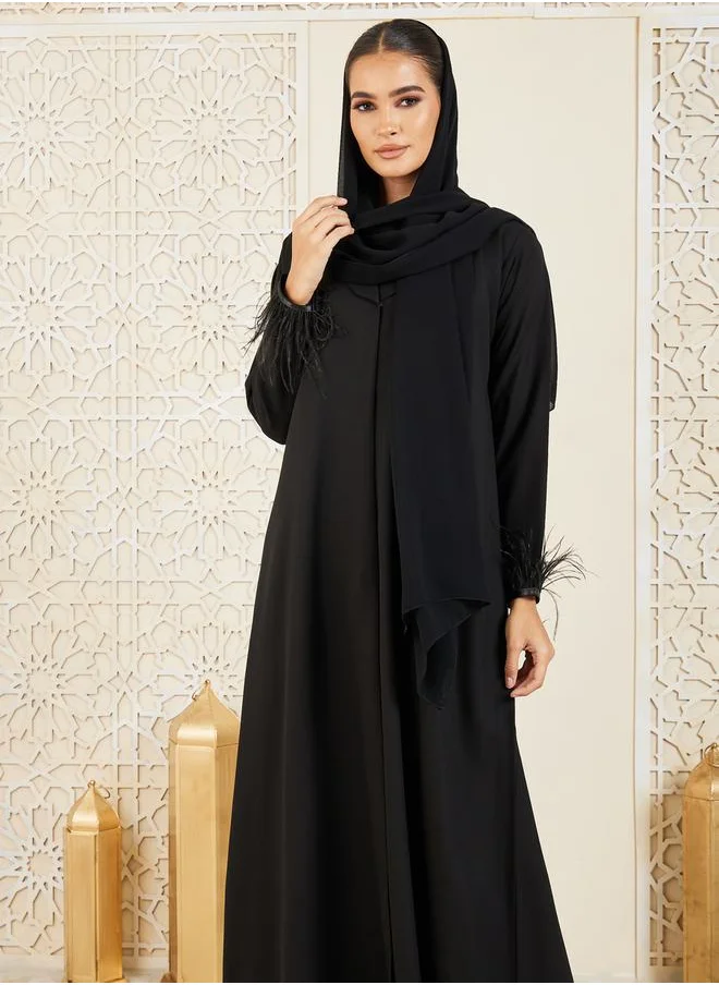 Modiste Faux Feather Hem Button Closure Abaya by Styli