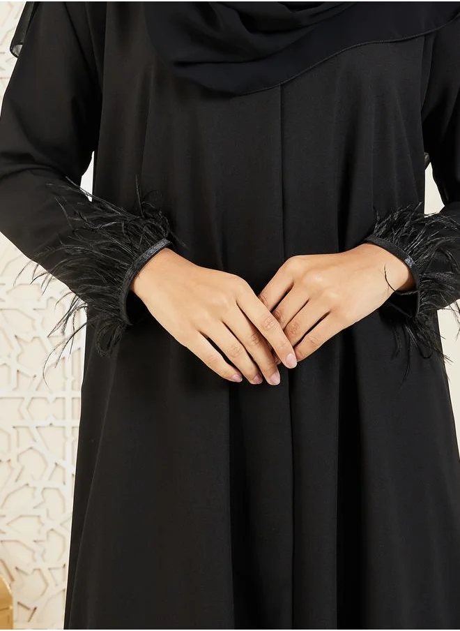 Modiste Faux Feather Hem Button Closure Abaya by Styli