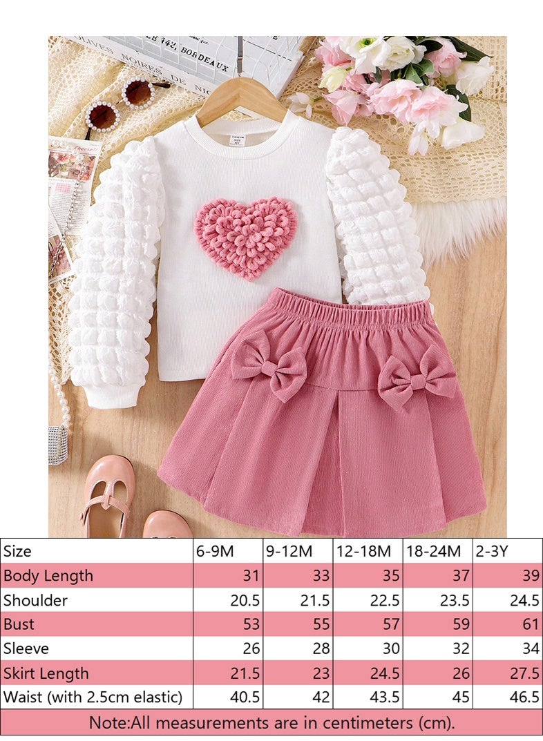 انسولار مجموعة متكاملة للفتيات للاستخدام اليومي والراحة: ملابس علوية علوية مبطنة بنقشة قلوب مضفرة ، تنورة مزينة بفيونكة من المخمل، لطيفة وحلوة للفتيات الصغيرات، للربيع والخريف ، 2 قطعة في المجموعة - Image 2