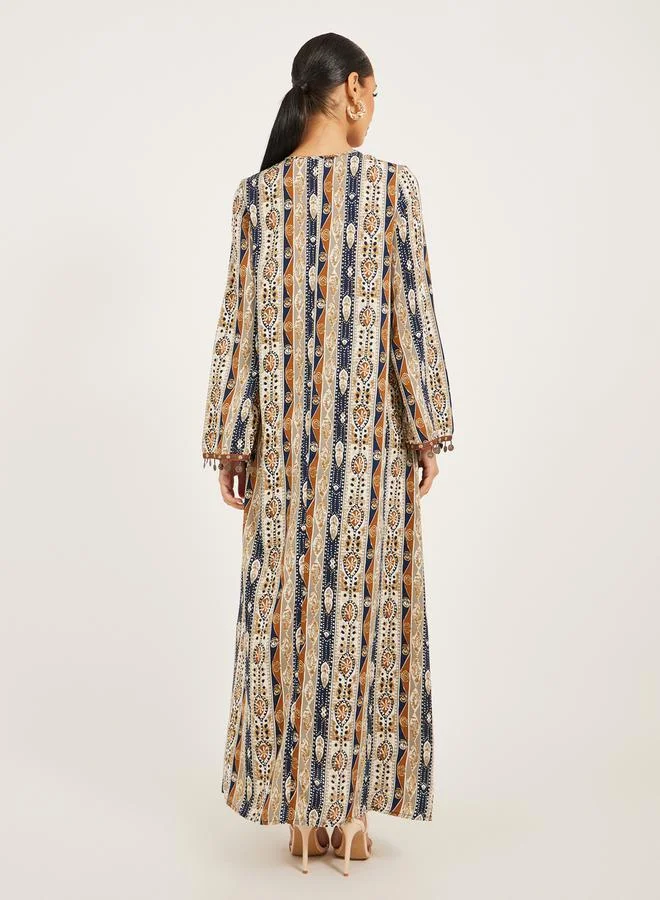 Styli stripe pattern print A line jalabiya w/ metal tassel trim at neck and sleeve hem