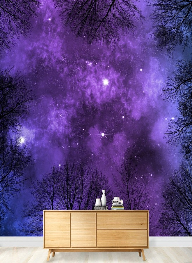 wall26 - Low Angle View of Colorful Nebula on Starry Night Sky in Forest, View Through Trees, Background - Removable Wall Mural | Self-Adhesive Large Wallpaper - 66x96 inches - Image 1