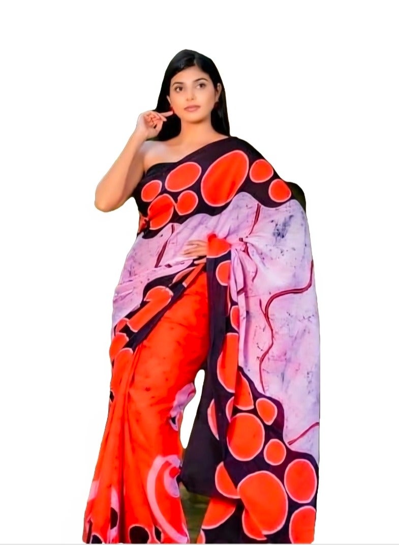 جــرابــمـــا نــتــرا   ساري من الكتان باللون البرتقالي مع قاعدة من قماش بالو أبيض وأسود بنمط دائري بالإضافة إلى بلوزة غير مخيطة