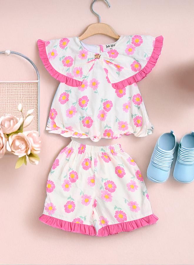 بيلا مودا طقم بلوزة بدون أكمام وشورت بطبعات وتفاصيل مكشكشة من بيلا مودا - Image 1