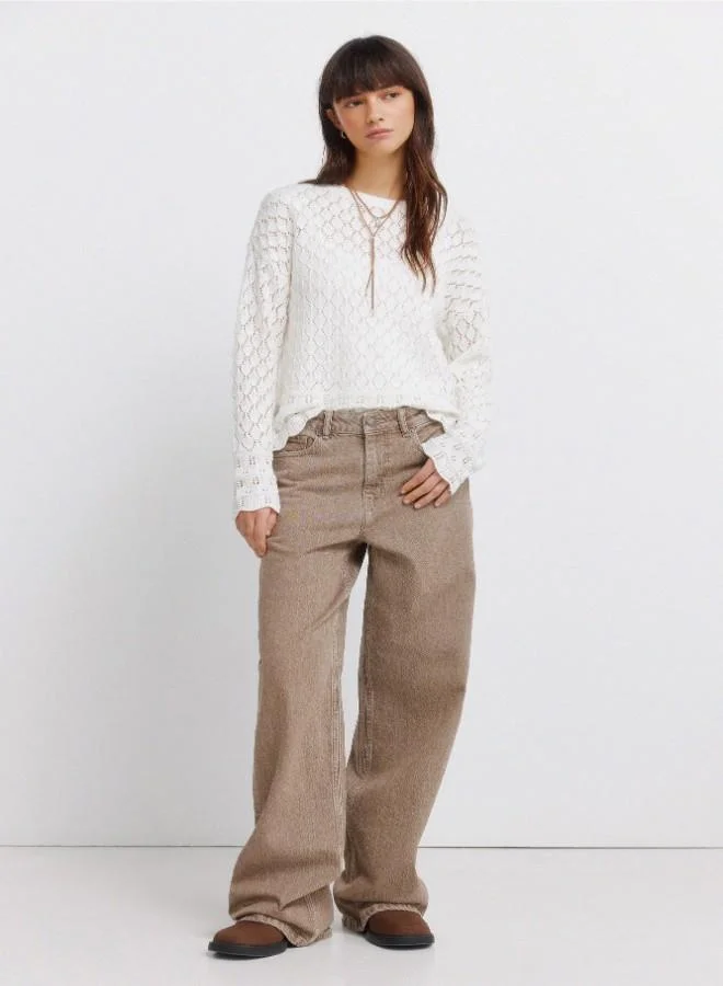 Springfield  Voluminous long sleeve jumper. Round neck. Pointelle knit with openwork details. Ribbed neck. Wavy hem and cuffs. This garment is made with sustainable cotton. for Women | Best Price UAE