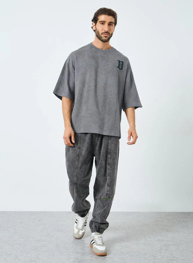 Styli Men Grey Acid Wash Boxy Fit Embroidered T-Shirt