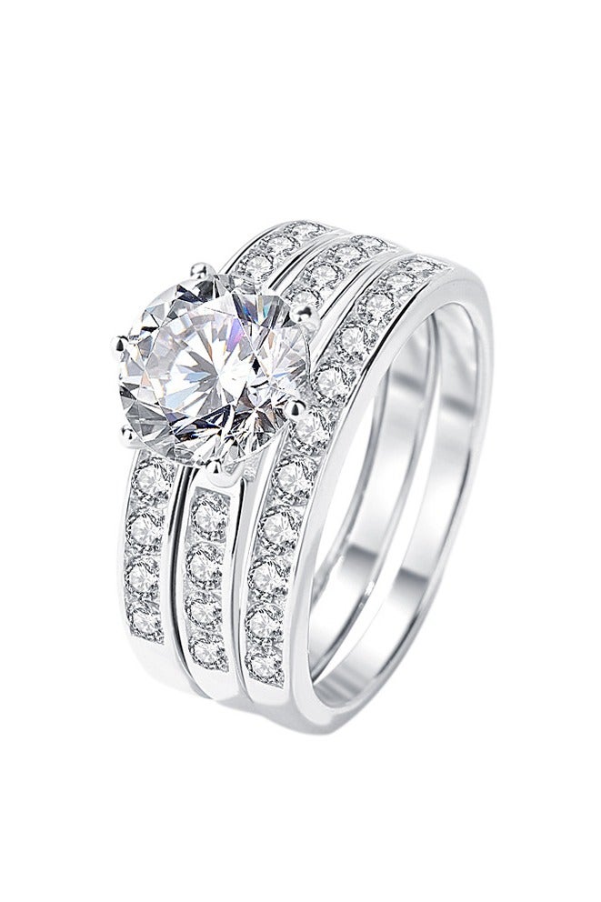 روماد مجموعة خواتم أنيقة مطلية بالذهب الأبيض مرصعة بفص ألماسي لامع في الوسط مع أحجار زركون جانبية تضفي لمسة فاخرة. - Image 1