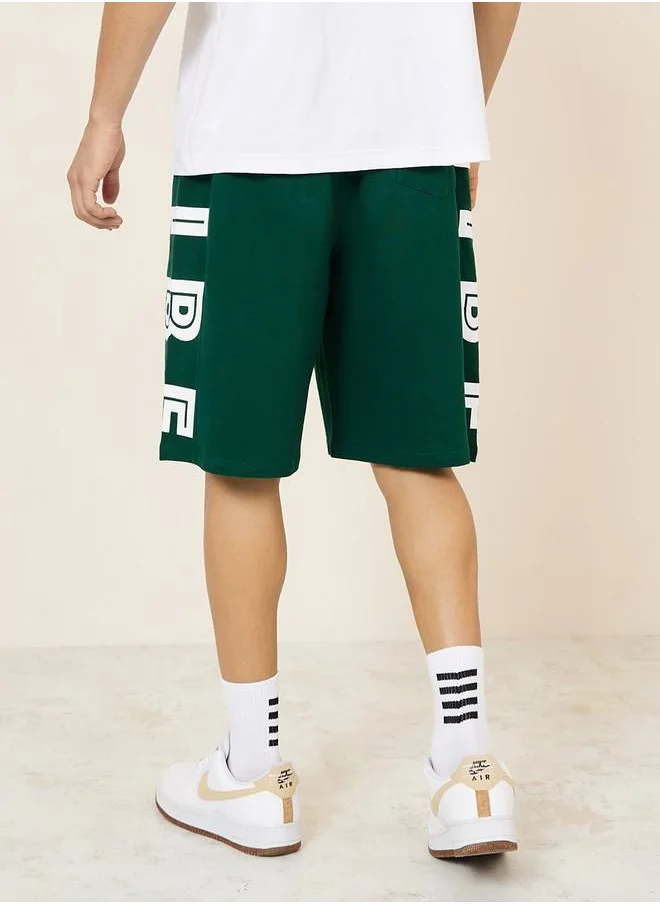 ستايلي Oversized Terry Shorts with Bold Text Print Detail