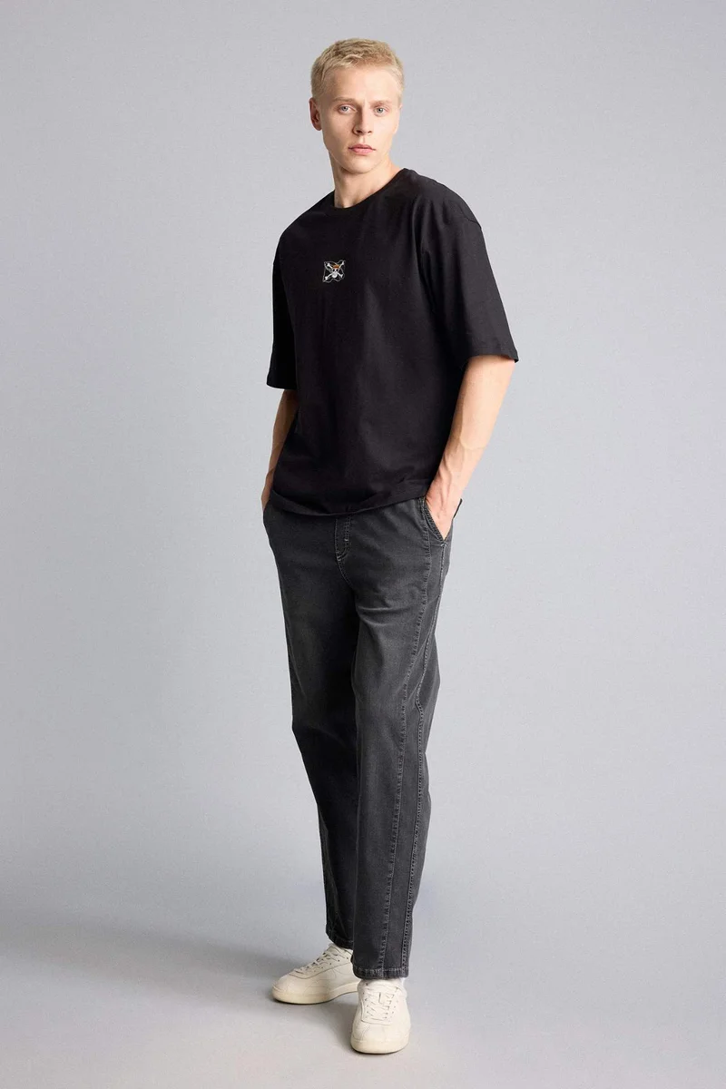 ديفاكتو One Piece Boxy Fit Printed Short Sleeve T-Shirt