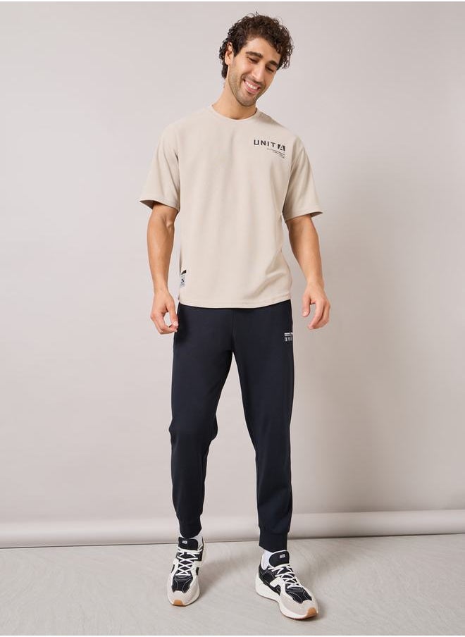 ANTA - Logo Print Waffle Knit T-Shirt - Image 1